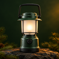 Forest-green camping lantern in theme-matched outdoor setting